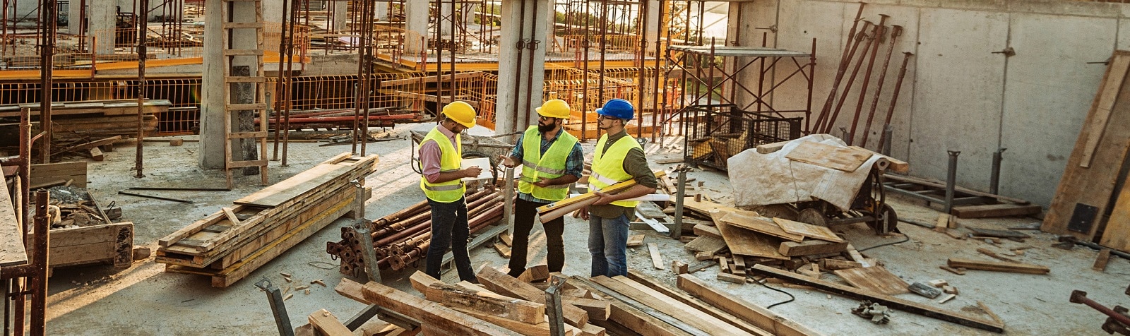 Construction site with three engineers