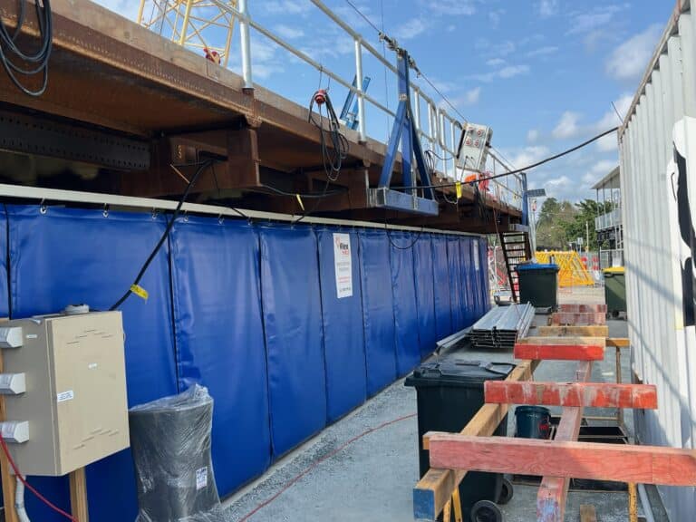 Blue Sonic Acoustic Curtains for construction noise control.