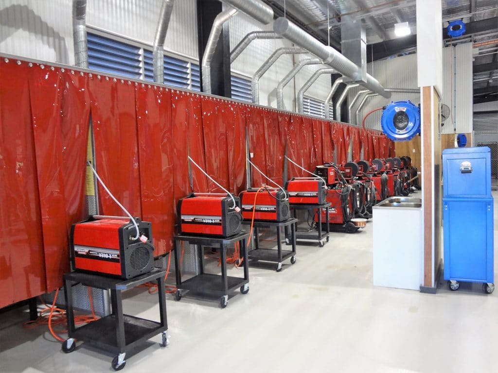 Flexshield WeldflexTM Strip curtains on a welding bay protect students from sparks while learning at a Trade Training Centre.