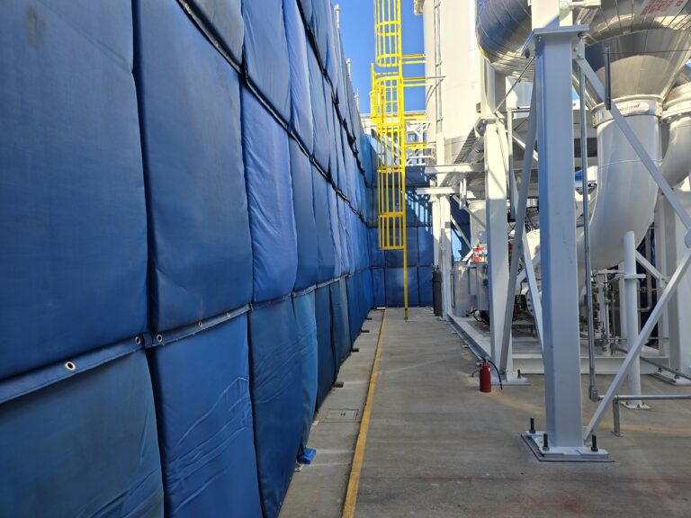 Blue Sonic Acoustic curtains with the absorption side facing the noise source
