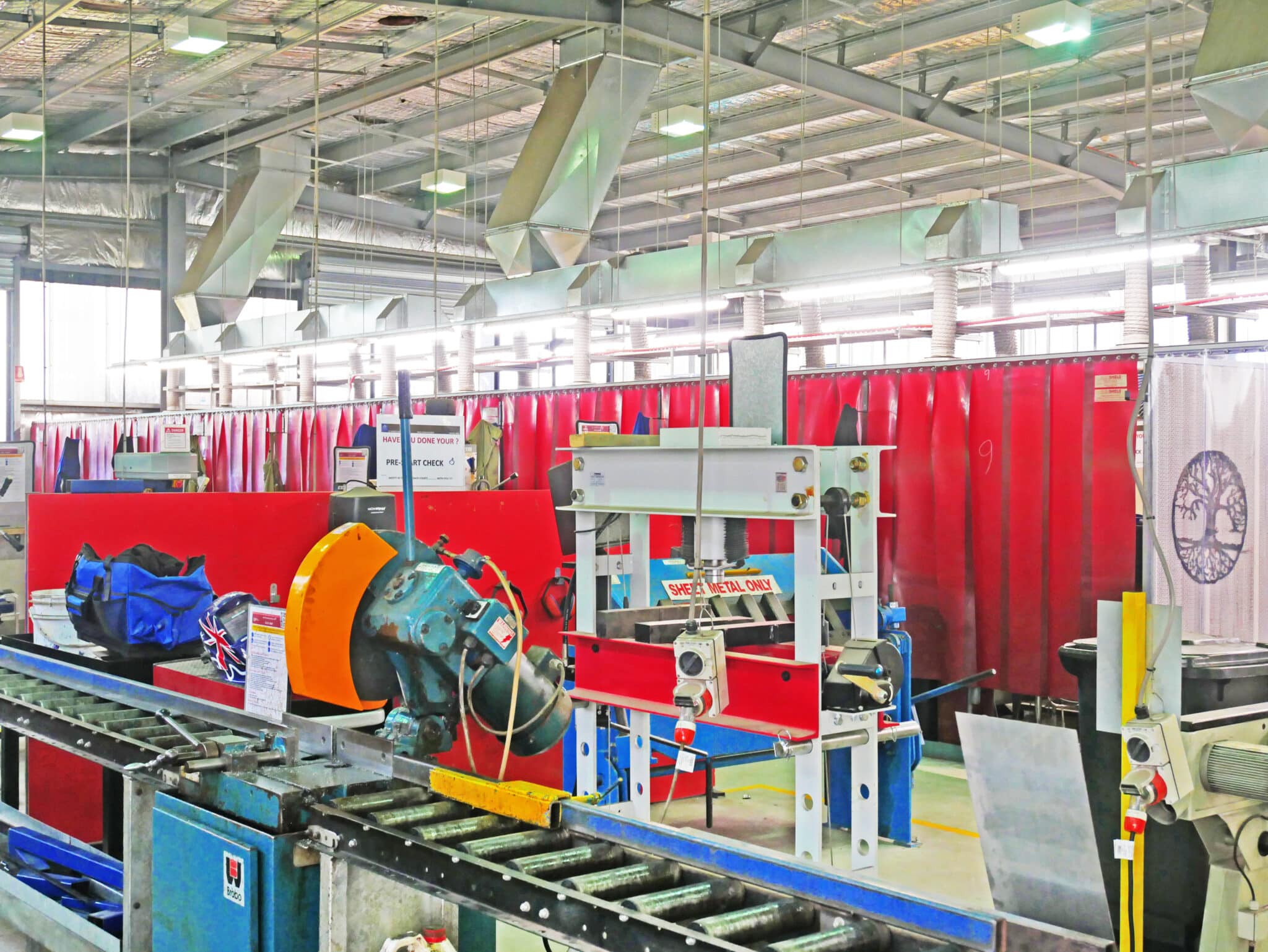 Flexshield acoustic welding bays for a high school.