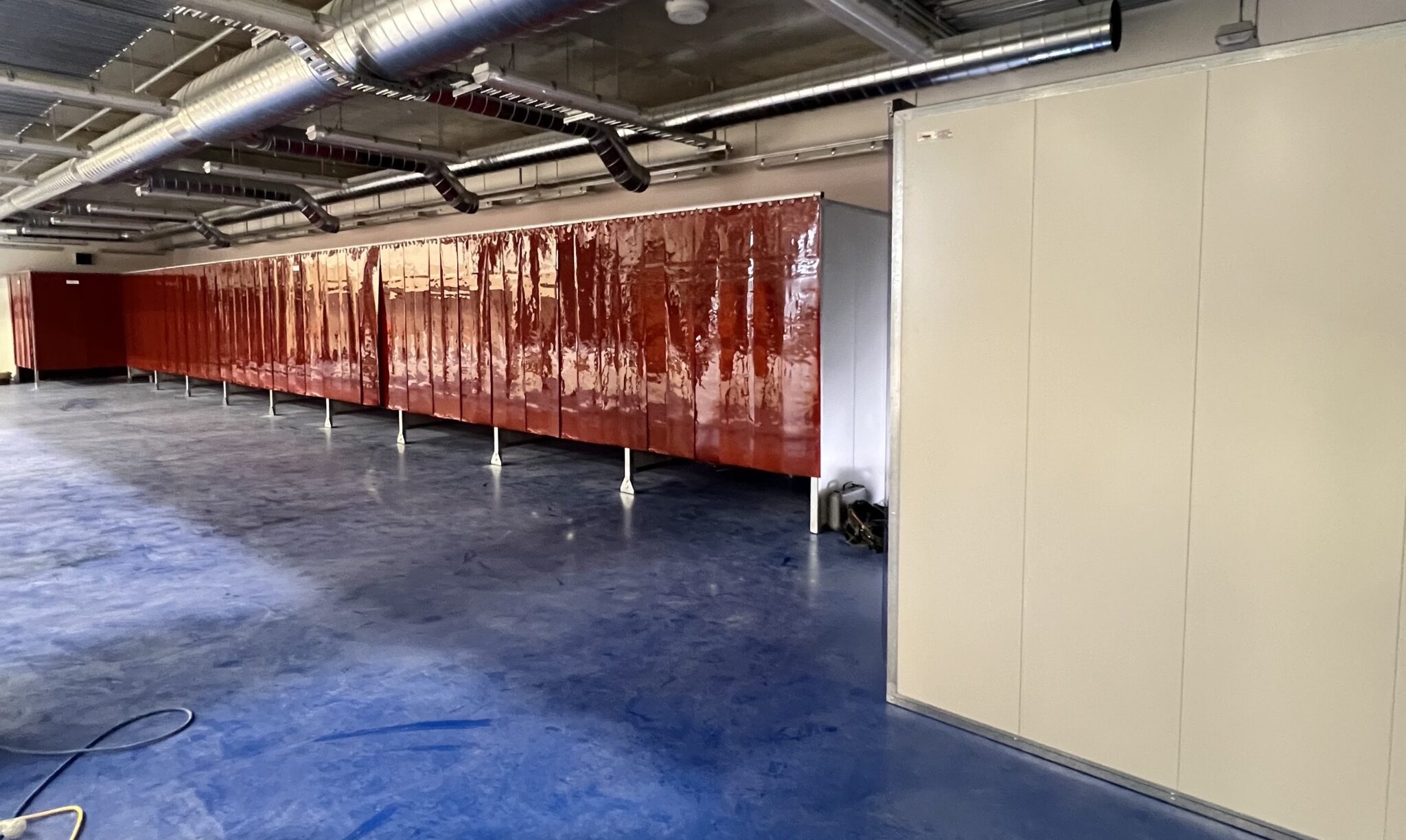 Weldflex red strip curtain feature as part of an acoustic welding bay