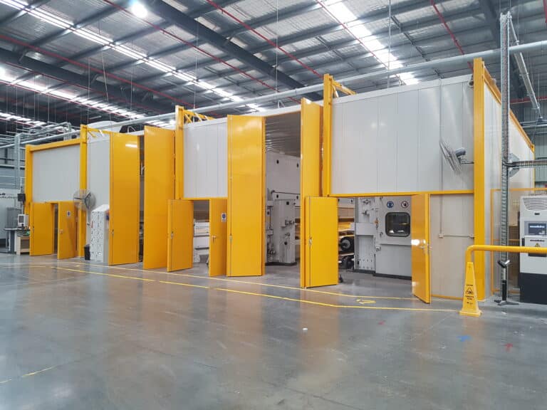 Yellow and cream acoustic enclosure with Sonic Access Acoustic doors and Sonic System acoustic modular panel for an acoustic enclosure