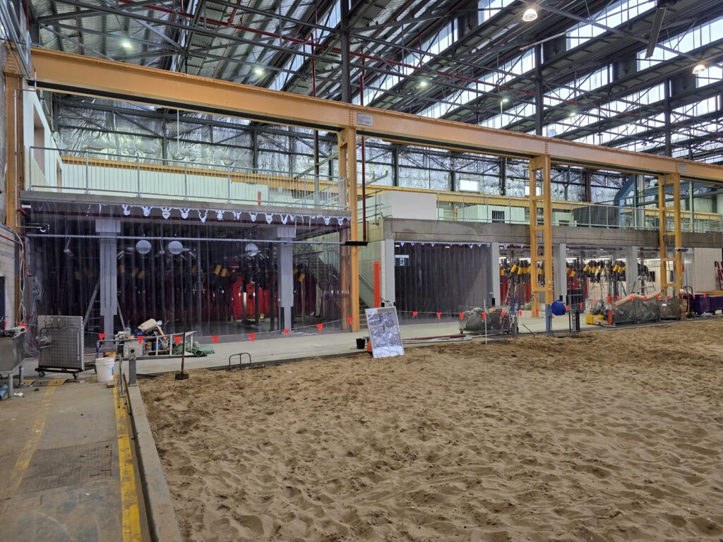 300mm-wide clear PVC strips overlap 50mm to minimise noise and dust transfer.