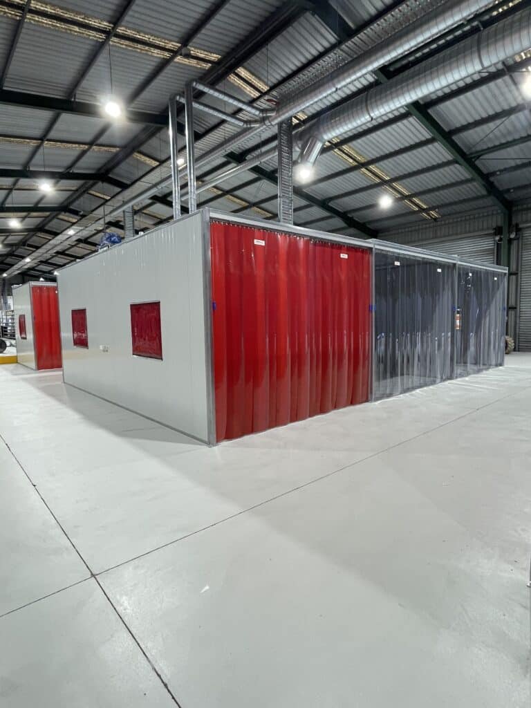Flexshield Weldflex and SonicClear Strip curtains on an acoustic welding and grinding bay