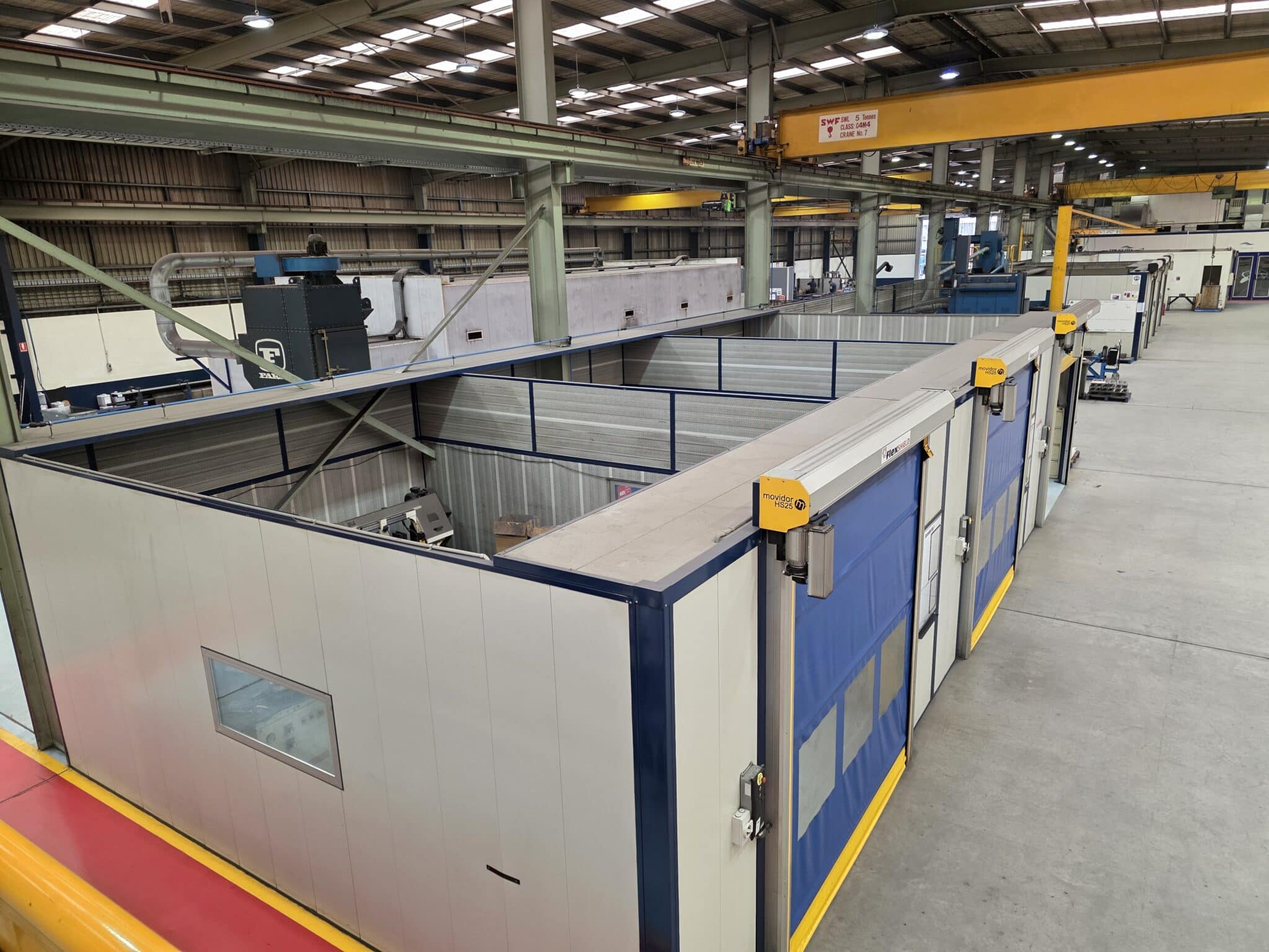 Flexhsield acoustic welding bays with rapid doors