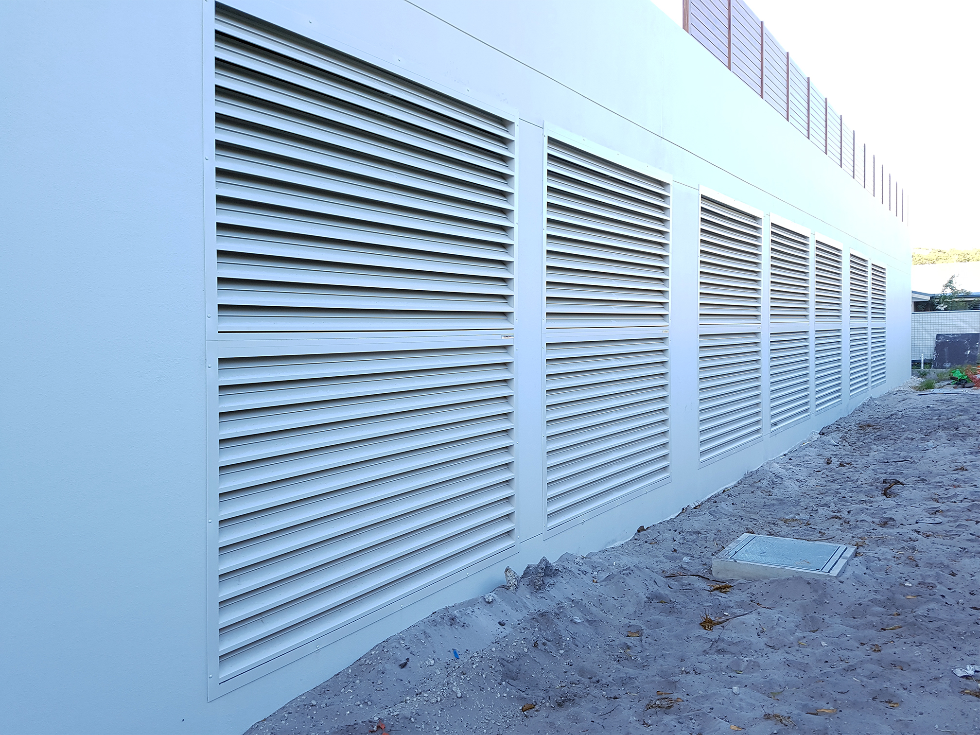 Sonic Series acoustic louvres in a wall