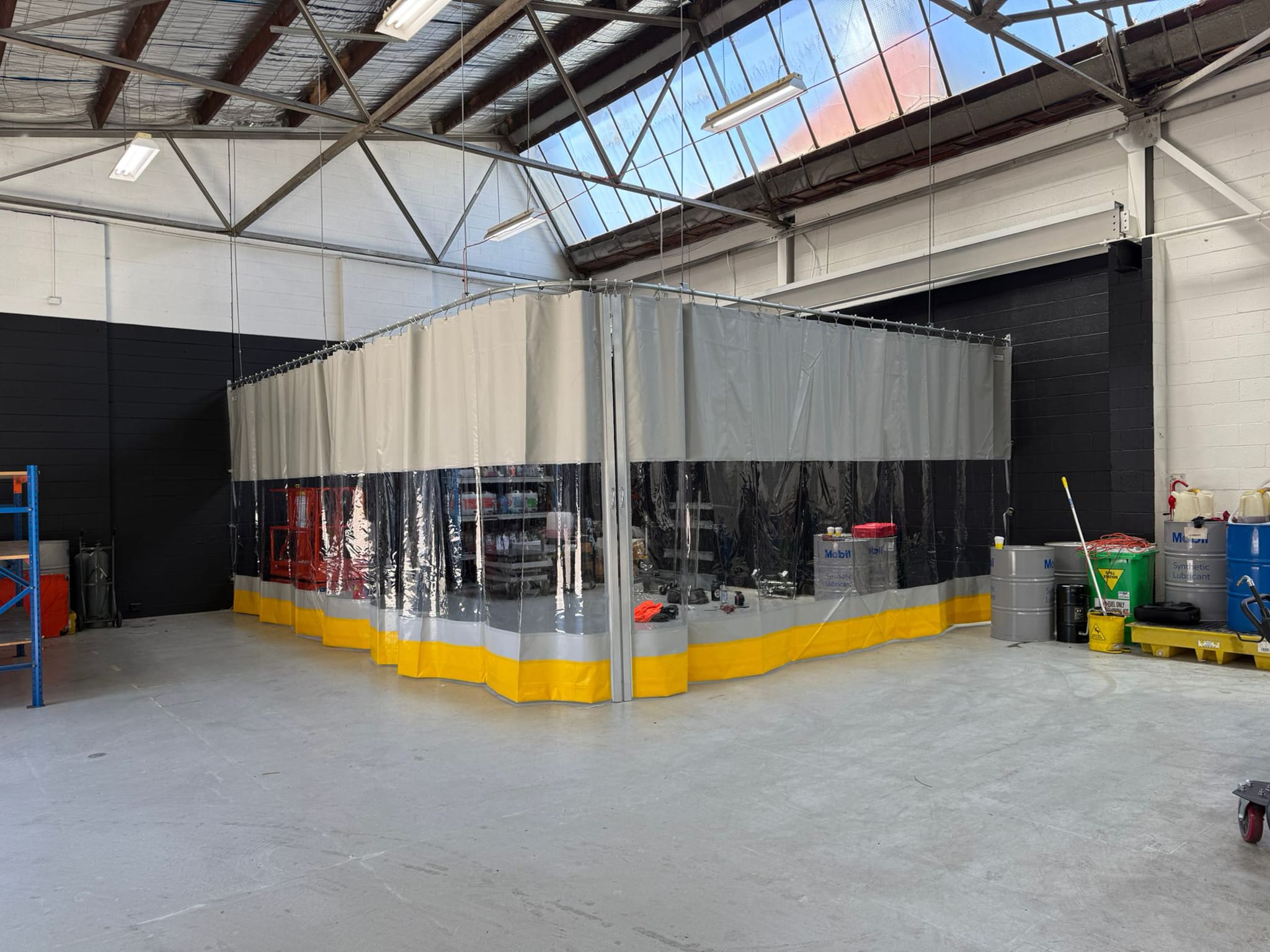 SonicClear washbay curtain for EV maintenance