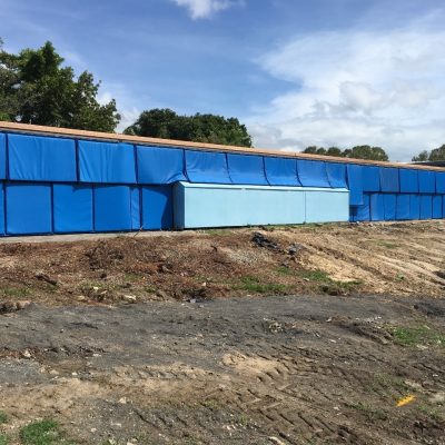 Sonic acoustic curtain for construction site noise reduction