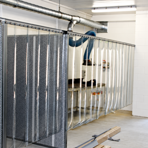 Flexshield grinding bay with SonicClear PVC strip curtains, Sonic System acoustic modular panels and Safe fume extraction.