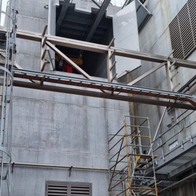 Custom Rw46 Sonic Access double doors, designed to integrate into a reduced height opening below the existing gantry crane beams.