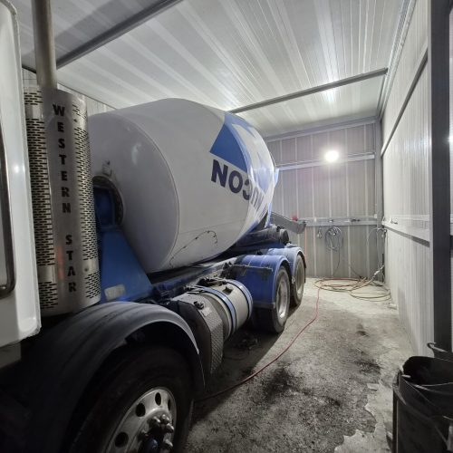 Flexshield Sonic acoustic enclosure surrounding a truck in an industrial facility