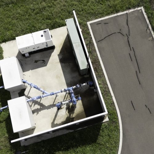 Aerial view of acoustic wall enclosing pumping and mechanical equipment at Cambooya