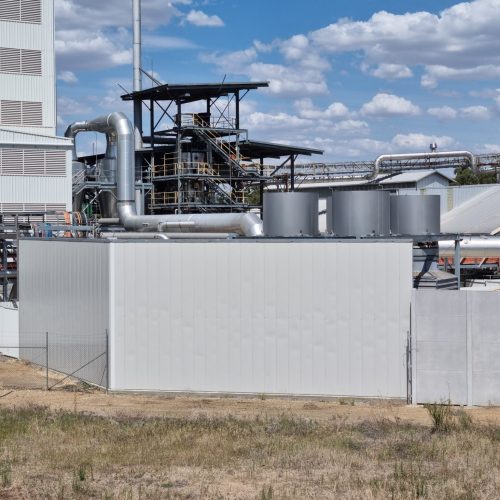 Large acoustic wall enclosing industrial plant equipment at GrainCorp Numurkah