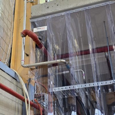 SonicClear strip curtains provide safe access to quench tanks and clear workshop visibility.