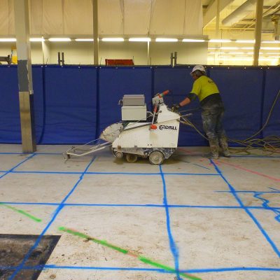 Flexshield sonic curtain to reduce noise for concrete cutting