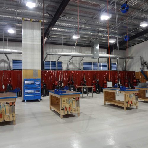 Acoustic welding bays with extraction